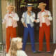 Barbershop trio singing in harmony on a street corner of Main Street USA