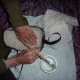 Here Tadpole is adding a gauze layer to further reinforce the inside of the mask. The gauze is laid on in overlapping squares, much like the original applique was.