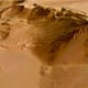 This close-up perspective view, looking south-west, shows the eastern scarp of the Olympus Mons volcano.