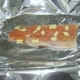 Butter is laid on trout fillet to ready it for baking
