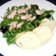 Trout flesh is flaked before being scattered over salad bed