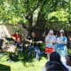 We did attempt to make some music after most had finished eating. That's me, in the red shorts, drafted to help lead. Too bad we'd not had a chance to sing this song together for about 20 years. Obviously, Dansen snapped this shot.
