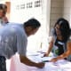 My husband is standing at the back of this picture "supervising" the distribution of name tags. Dansen gets credit for this photo.