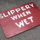 Slippery when wet! Sign just left around the pool area. Photo - Edward M. Fielding