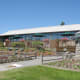 There are flowers in front of the Horizons Restaurant as well as behind it.