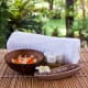 Loved ones feel they are in a luxurious spa instead of a nursing home room with elegant furnishings like this. Purchase the items at a discount store, arrange them atop the dresser, and roll up a towel to create this look.