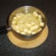 Diced potatoes and Swede are added to strained chicken broth