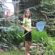 Olivia enjoys spending time at Auntie's Creek catching frogs