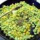 Add the butter, sage, salt and pepper. Stir and heat through. Serve hot.