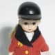 Madame Alexander Equestrian doll in classic red jacket with buff colored breeches