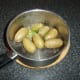 Butter and chives are added to potatoes