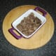 Oxtail is laid in base of mini 5" by 4" pie dish