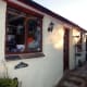 Windows and door in the food store and adjoining workshop.