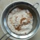Sifting flour, baking powder, baking soda and spices.