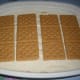 The second layer with mango slices and Graham Crackers before the decoration.