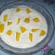 Add mango slices and cream mixture. Then decorate with small slices of mangoes.