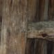Hand hewn horizontal timbers held in place with wooden pegs.