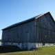 Barn siding was applied vertically rather than horizontally. Small gaps between boards provided ventilation.