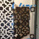I needed to use a lot of tape to keep the stencil flush to the wall. Working around the door moulding was tricky.