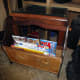 Test of the modified magazine rack with magazines before wood staining newly fitted pieces to match the original wood.