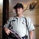 Antigua Guatemala: armed guard stands at the entrance of a jewelry store.