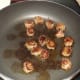 Italian sausage frying.