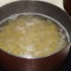 Boiling bow tie pasta.