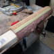 Using timber inside a tube from an old scratching post for additional support to a cat tree