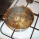 Chicken is added to soup to heat