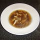 Plated chicken and porcini mushroom soup
