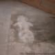 The stain on the concrete from her bodily fluids.