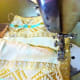 Fold and sew upper edge such that you can insert the colored ribbon