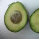 Cut open avocado and mash wth a fork.