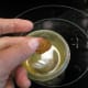 Drop some of the syrup into ice water, if it forms a ball, it should be ready to pull