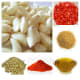 Ingredients: clockwise—garlic, tomatoes, mustard seeds, mustard oil, chilli powder, coriander seeds