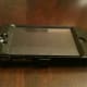 The iPhone 4 with the front and back part of the OtterBox Defender series hard plastic shell assembled.