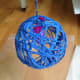 Once dry, pop the balloon with a pin and pick the balloon pieces out with your fingers or tweezers.