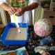 Saturate the paper strip and wipe off excess liquid.