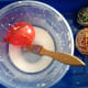 Paint glue mixture onto the balloon.