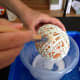Use a paintbrush to saturate thick areas of string.