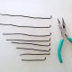 Use pliers to bend one end of each wire up so that it will support a clay planet.