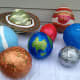 Paint swirls, strips, circles, and rings to complete your planets.