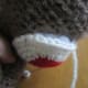 Stuff and stitch on to face.