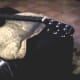The strings off the neck; pillow propping up guitar.
