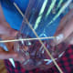 Skewers will form an X pattern at the bottom of the pop bottle bird feeder.
