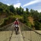 It is exciting to ride a motorbike on a suspension bridge.