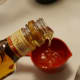 Add 3/4 cup of rum to the blender.