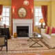 Coral & Yello Wall Theme. The Coral Over The Fireplace Sets The Focus.