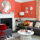 Coral Colored Wall with a Blend of Grey Furnitures & Red Lamp. Unique Combination!