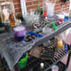 Lab supplies with different effects (dry ice, colored water, specimen jars, water beads).